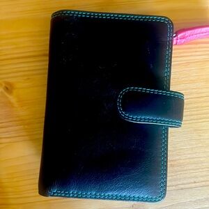 Medium size, black leather wallet with a rainbow interior.